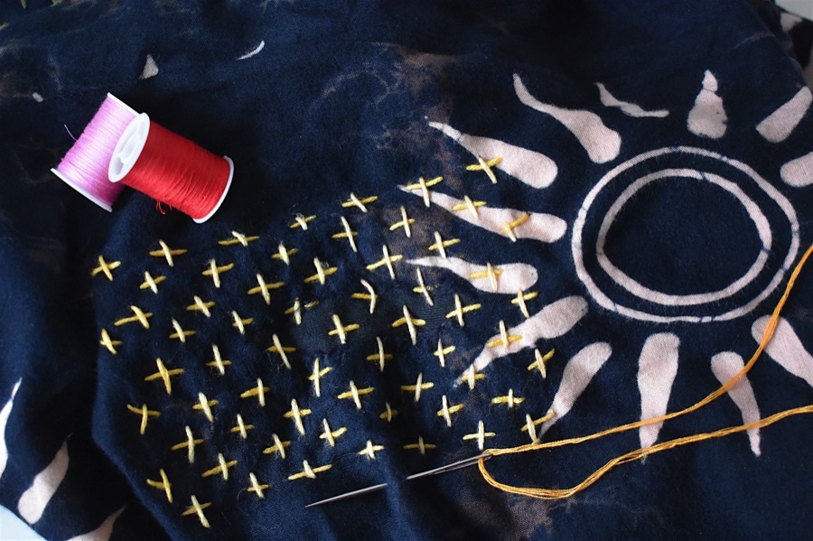 Sashiko embroidery used to mend a pair of trousers