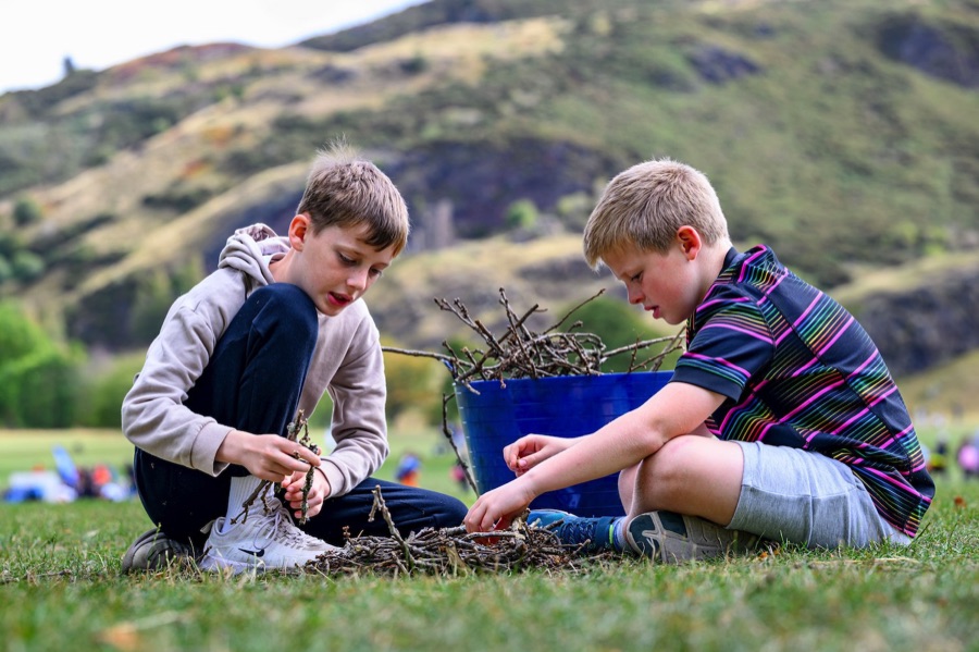 Two children taking part in an outdoor learning activity